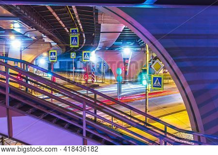 Crossroads Traffic Lights At Night And Aboveground Pedestrian Crossing City