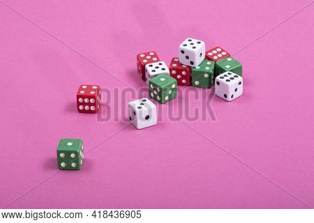 Multicolored Traditional Dice On A Colored Background