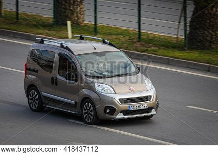Alanya, Turkey  - April 13  2021:   Beige Fiat Duplo Is Driving Fast On The Street On A Warm Summer 
