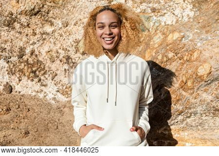 Beautiful woman in white hoodie winter fashion