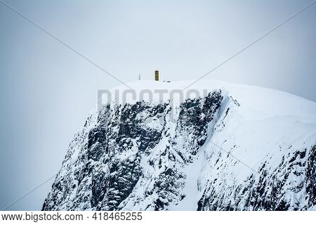 Mount Bitihorn Peak In Beitostølen Norway, Covered In Snow On A Cold Winters Day.