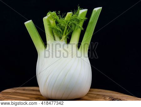 Green White Fennel On Brown Olive Wood
