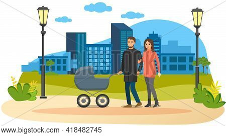 Young Parents Strolling In Park With Gray Baby Stroller. Dad Rolls Stroller With Newborn, Wife Holds