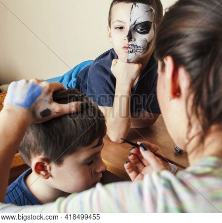 Little Cute Child Making Facepaint On Birthday Party, Zombie Apocalypse Facepainting, Halloween Prep