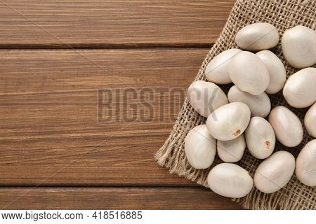 Raw Jackfruit Seeds On Wooden Table, Top View. Space For Text