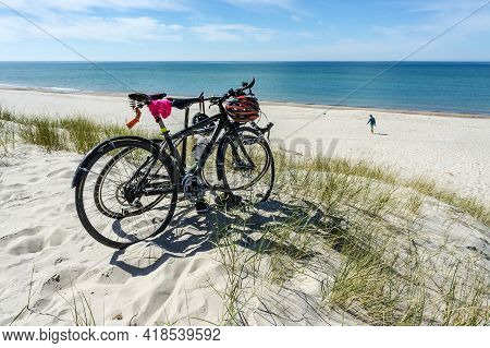 Kaliningrad Region, Baltic Sea, Russia, May 10, 2020. Two Bicycles On The Seashore. Walking On The S