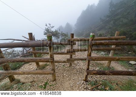 Wooden Fencing In The Mountains To Prevent The Passage Of Animals And Vehicles. Morcuera. Madrid.
