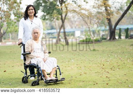 Doctor Help And Care Asian Senior Or Elderly Old Lady Woman Patient Sitting On Wheelchair At Nursing