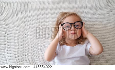 Funny Toddler Cute Curly Girl Wear Eyeglasses.