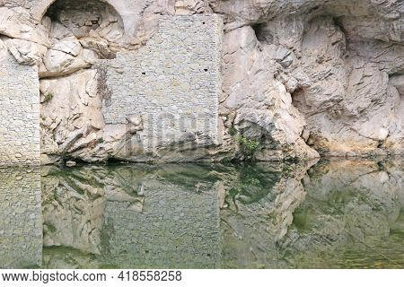 Reflections In The River Of Pont-en-royons Village In France