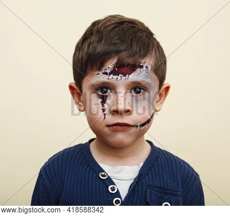 Little Cute Child With Facepaint On Birthday Party, Zombie Apocalypse Facepainting, Halloween Prepar