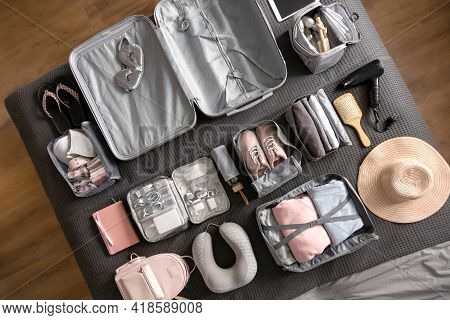 Top View Composition With Neatly Packing Things, Clothes And Accessories For Travel Konmari Method
