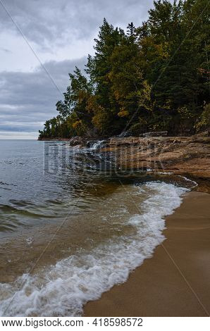 Early Color Shows In The Forest Abover Miners Beach Falls On The Lake Superior Shore, Pictured Rocks