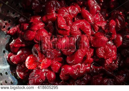 Fresh Thawed Seedless Cherries In A Metal Colander. Close-up Of Ripe Berries Ready To Eat. Berries F