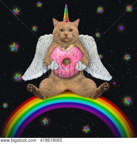 A Reddish Cat Unicorn With Wings Sits On A Rainbow And Eats A Pink Donut At Night.