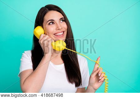 Photo Of Young Excited Girl Happy Positive Smile Call Talk Handline Phone Look Empty Space Isolated 