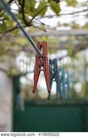Colored Clothespins On A Blurred Background Close Up