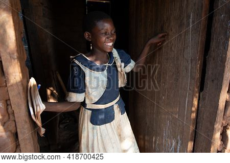 Mzuzu, Malawi. 30-05-2018. Portrait Of A Black Girl Student With School Uniform Smiling At The Entra