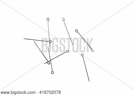Set Of Stationery Pins On A White Background