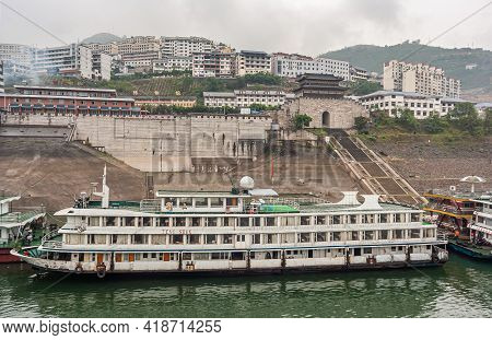Baidicheng, China - May 7, 2010: Qutang Gorge On Yangtze River. White Passenger Boat Docked On Quay 