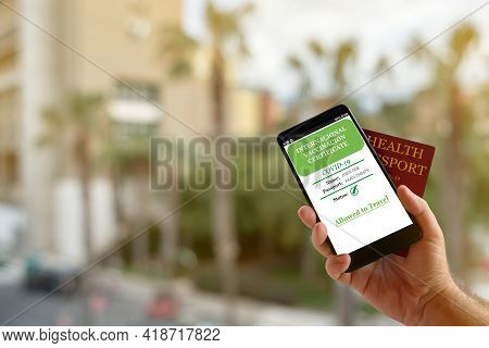 Smartphone With Valid Digital Vaccination Certificate Covid-19.inmunity Passport, Health And Surveil