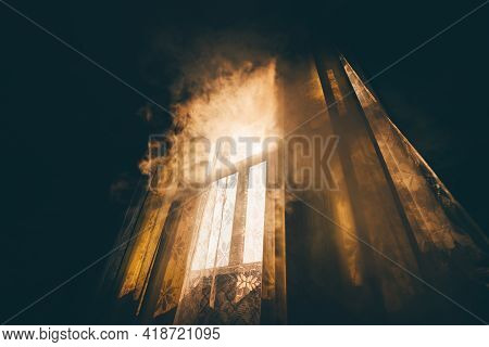 A Wide-angle Mysterious View From A Dark Room On A Smoke-shrouded Window Lit By Morning Or Evening S