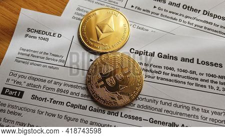 Qawra, Malta 27.04.2021 - Cryptocurrency And Capital Gains. Ethereum And Bitcoin Over 8949 Form And 