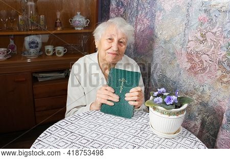 The Elderly Senior Woman With Bible Book