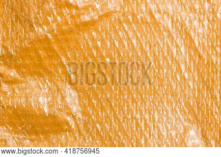 Small Yellow Post Packet Packaging Texture. Plastic Bubble Wrap Background