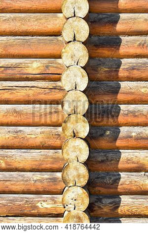 Texture Of Wall Of House Made Of Rounded Logs. Facade Of Log House, Space For Text. Wooden Log Wall 