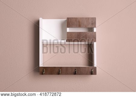 Wooden Hanger For Keys On Color Wall