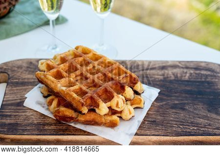 Breakfast With Fresh Baked Belgian Waffles And Brut Champagne Sparkling Wine In Flute Glasses Served