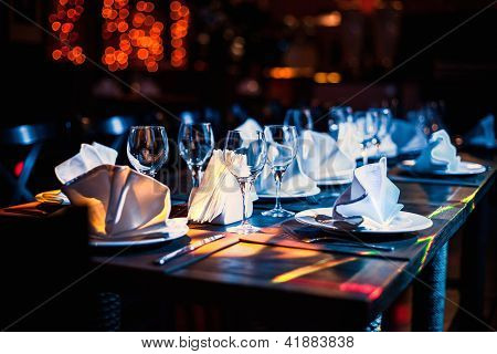 Wine Glasses On The Table In The Dark
