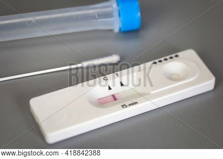 Rapid Self Test Covid-19 With Nose Swab, Home Test Kit For Coronavirus Top View On Gray Background W