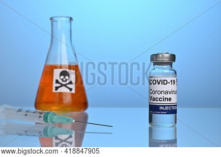 Covid Vaccine With Inoculation Syringe And Poison Dose. Covid-19 Vaccination Set With Syringe And Vi