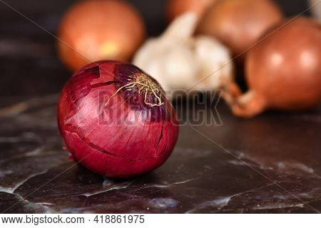 Whole Red Onion With Purplish-red Skin And Root
