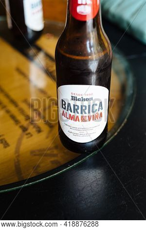 Madrid, Spain - April 24 - 2021: Bottle Of Mahou Beer. Alma De Vina Craft Beer On Table Of Bar