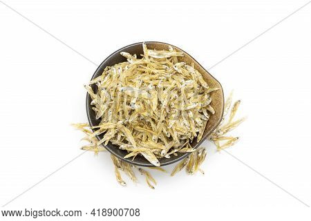 Dry Anchovy (stolephorus Indicus) Fish In Ceramic Bowl Isolated On White Background.