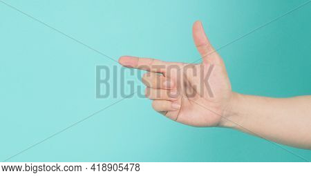 Empty Hand Holding Or Catch Nothing Guesture On Green And Blue Or Mint Background.
