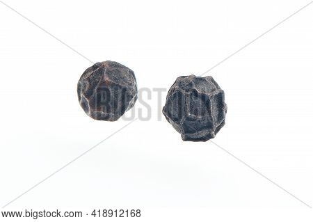 Two Black Pepper Grains Isolated On White Bacground. Heap Of Dry Peppercorn Spice. Black Pepper Seed