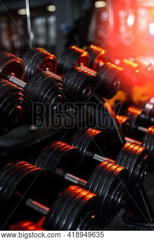 Rows Of Dumbbells In The Gym. Modern Gym