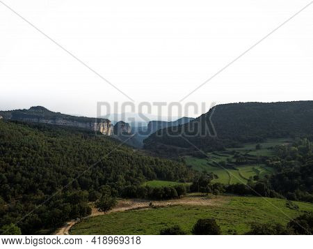 Panorama View Of Stone Rock Cliff Gorge Canyon With Green Grass Meadow Fields Near Tavertet Osona Ba
