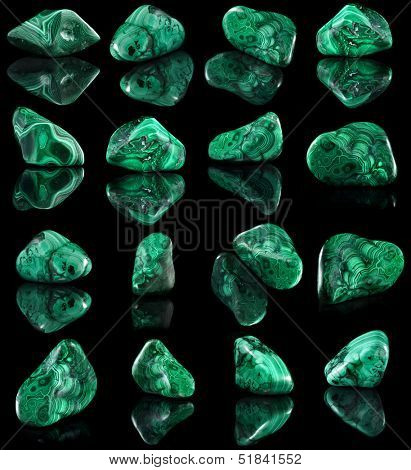 Collection set of malachite mineral stone close up  with reflection on black surface background