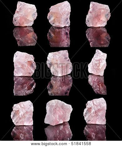 Collection of Natural Rose Quartz crystal with reflection on black surface background 