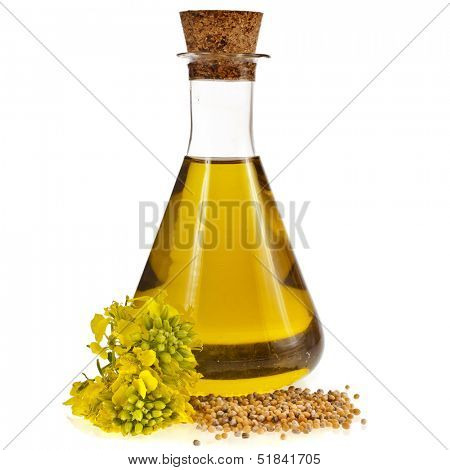 oil glass jar and mustard seeds with flower isolated on white background 
