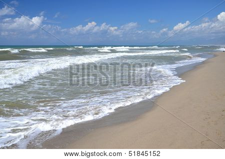 Restless sea on sandy beach Marina di Vecchiano nearby Pisa, Tuscany in Italy
