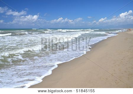 Restless sea on sandy beach Marina di Vecchiano nearby Pisa, Tuscany in Italy