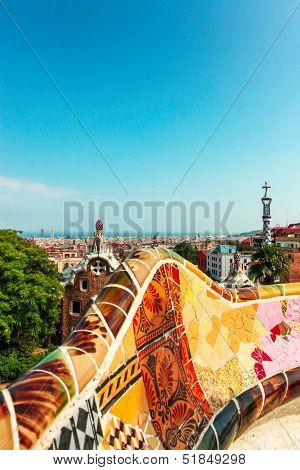 BARCELONA, SPAIN - JULY 19: Ceramic mosaic Park Guell on July 19, 2013 in Barcelona, Spain. Park Guell is the famous architectural town art designed by Antoni Gaudi and built in the years 1900 to 1914