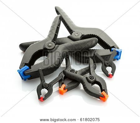 Plastic clamps on white background