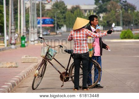 Local Woman Selling Ice Cream On The Street, Vientiane, Laos